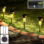 Ground stakes of solar lawn lamps set of 12 lighting up lawn area at dusk