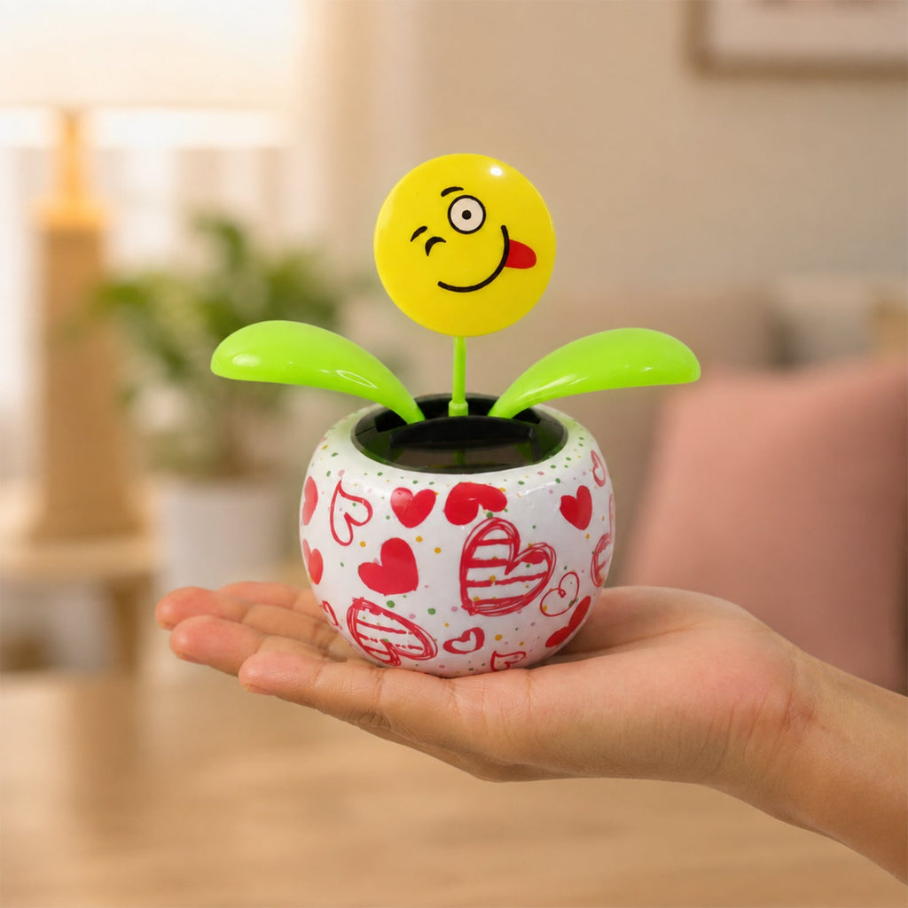 Solar activated bobbing flower toy for dashboard and shelves