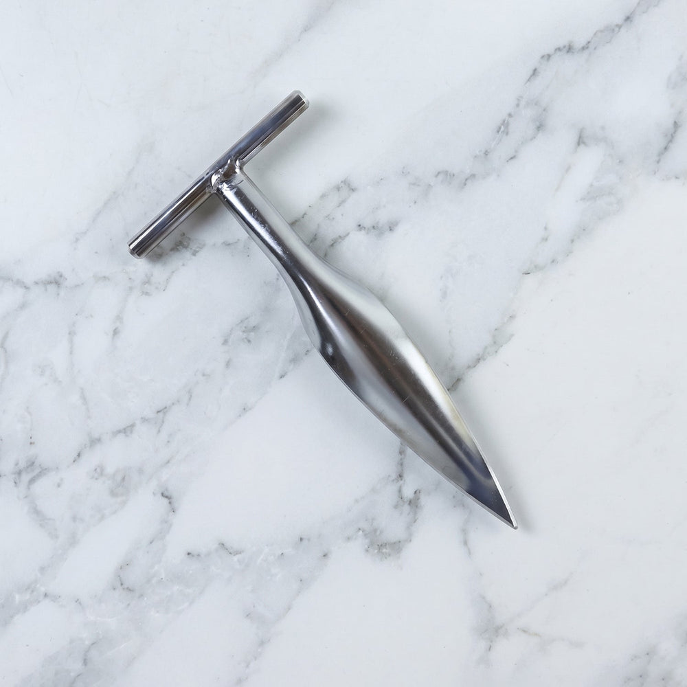 Stainless steel coconut breaker tool set displayed on a white background