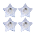 Flameless LED candles shaped like stars providing ambient light