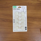 Practical use of self adhesive round wall hooks on a home wall