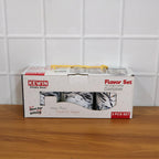 Tea, coffee, and sugar storage containers with vibrant flavor prints on kitchen counter