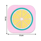 Bright yellow lemon silicone drink coaster displayed on coffee table