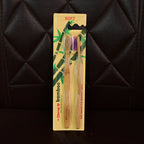 Angled view highlighting bamboo toothbrush with medium bristles