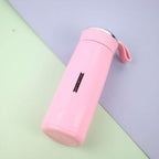 Close-up of pink glass water bottle with secure bamboo lid