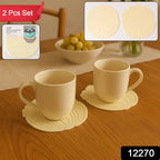 Two green silicone leaf coasters holding a cup of tea