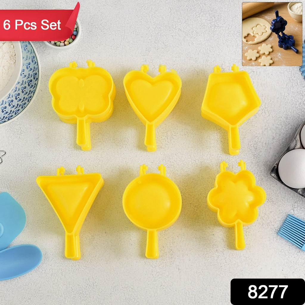 Close-up of vibrant plastic cookie cutters shaped like stars and flowers.