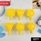 Close-up of vibrant plastic cookie cutters shaped like stars and flowers.