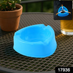 Plastic ashtray placed on outdoor patio table