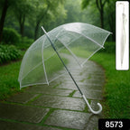 Clear transparent dome umbrella in use on a rainy street with full visibility
