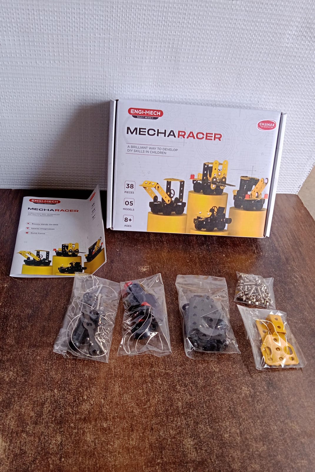 Mecha Racer Kit box with various completed mechanical models displayed