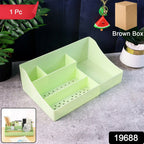 Multi-section plastic organizer storage tray holding pens and stationery