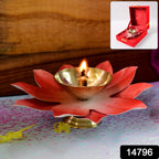 Close-up of lotus shaped brass oil diya showing polished brass bowl