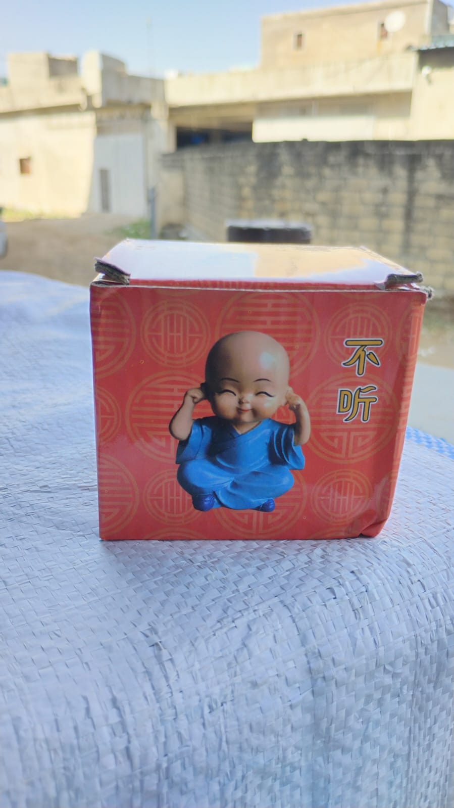 Detailed shot of one Baby Buddha figurine, emphasizing its craftsmanship.