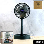 Foldable USB desk fan placed next to a phone on office table
