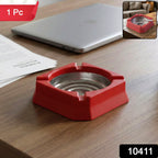Compact heat-resistant ashtray placed on a modern home office desk