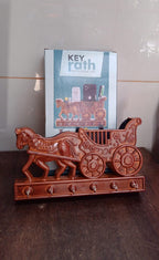 Product packaging for the Indo Glow Rath wall key holder, ensuring safe delivery.