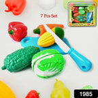 Close-up of vibrant toy vegetables featuring hook-and-loop fasteners for pretend slicing.