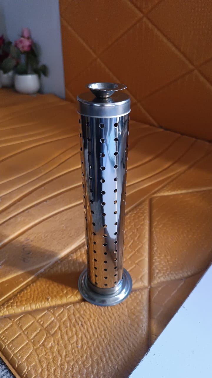Close-up of stainless steel incense stand with child-safe design