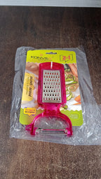 Peeling potatoes using the stainless steel 2-in-1 kitchen peeler and grater tool