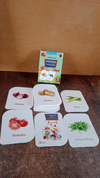 Assorted vegetable flash cards laid out for toddlers to learn vegetable names and images