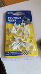 Various plastic cable clips display showing steel nail wire holders in a batch