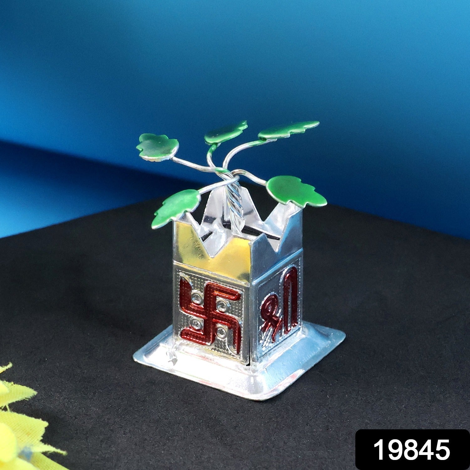 Close-up of the Tulsi Idol, highlighting the sacred Swastik and Shri motifs.