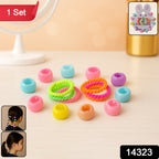 Close-up of pastel crown-shaped claw clips and soft elastic hairbands for girls