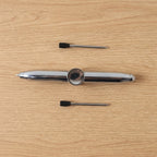 Compact multifunction spinner pen for stress relief and writing