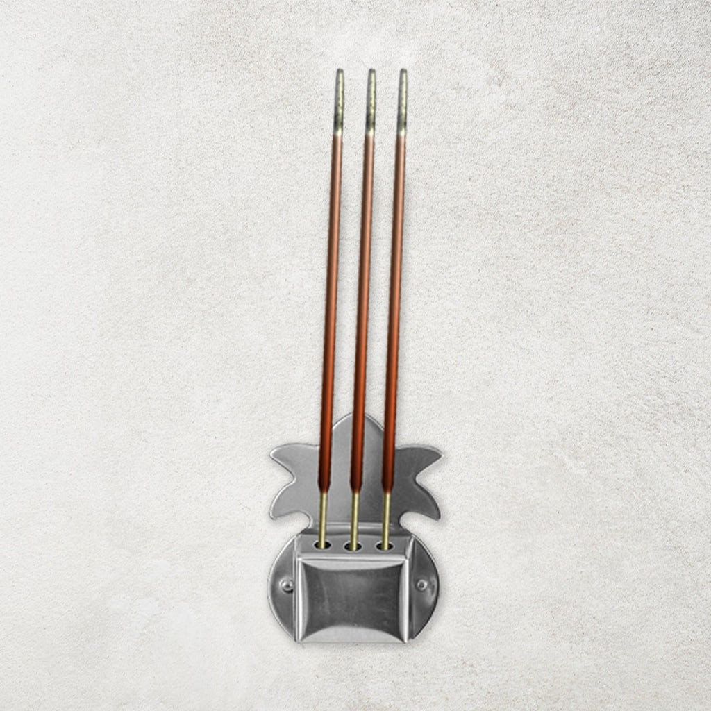 Set of three durable metal incense stick holders ideal for pooja room rituals.