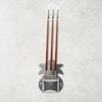 Set of three durable metal incense stick holders ideal for pooja room rituals.