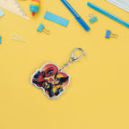 Fashionable acrylic keychain showing colorful cartoon characters and metal clasp