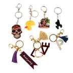 Collection of assorted designer keychains for bags and keys