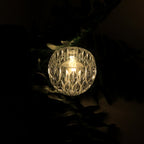 Close-up of crystal style LED decorative lamp showing diamond-cut design