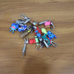 Cartoon Nail Cutter Keychain attached to a set of keys for convenience