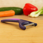 Dual tone vegetable peeler designed for comfortable grip and smooth peeling