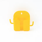 Mobile phone stand with hook holding phone and hanging accessories on wall