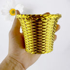 Valencia plastic flower pot shown in outdoor garden setting