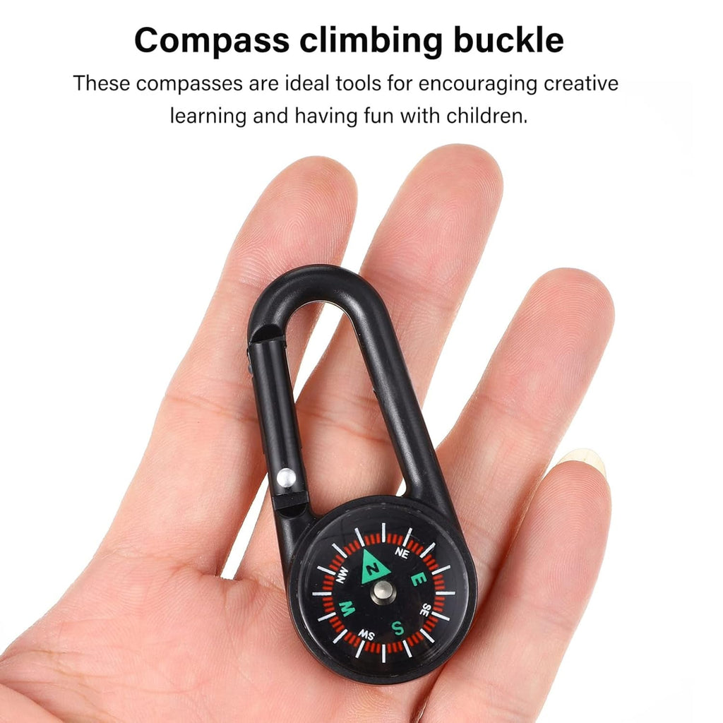 A person holding the mini compass with clip, demonstrating its portability and ease of handling.