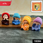 Set of four resin monk Buddha figurines in vibrant robes with straw hats for spiritual home décor