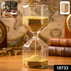 Side view of a decorative 4-minute sand timer hourglass with flowing yellow sand.