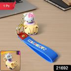 Close-up of cartoon cat riding toy car silicone keychain