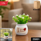 Faux bonsai plant with white flowers in a ceramic pot