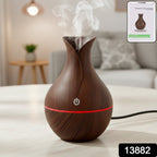 Compact Mini Wooden Humidifier creating a serene ambiance in a modern living space.