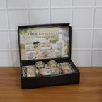Tea cup and saucer set featuring classic floral design with gold accents