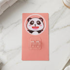 Bathroom setting with cartoon plastic wall hook for towels